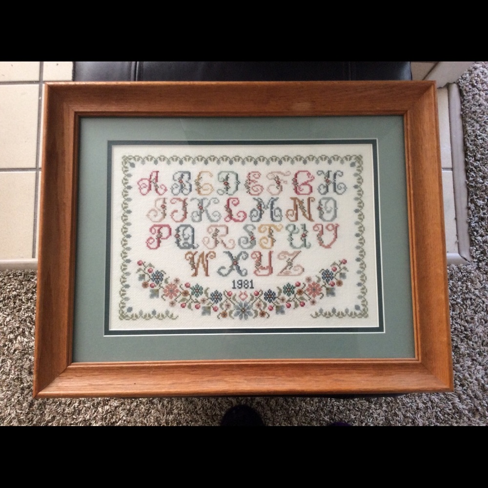 Alphabet cross-stitch in a vintage wood frame
